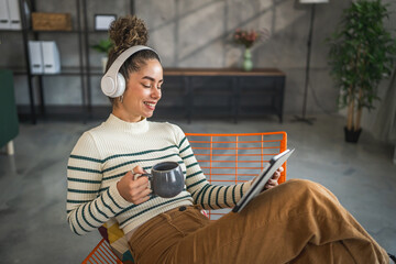 Woman sit at home use digital tablet to watch movie or have video call