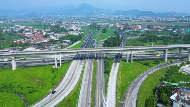 Established Aerial View of Pasir Koja Interchange, the meeting point of Soroja Toll Road, Purbaleunyi Toll Road and Jakarta-Bandung High Speed ​​Rail Line, Bandung, Indonesia