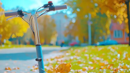 Close-up of an electric scooter handle with a cityscape, green commuting