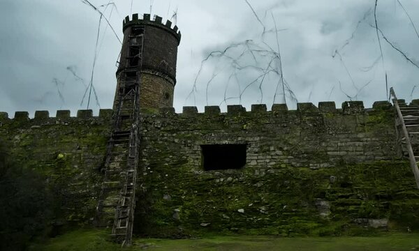 Abandoned Medieval Siege Tower Near a Castle Wall