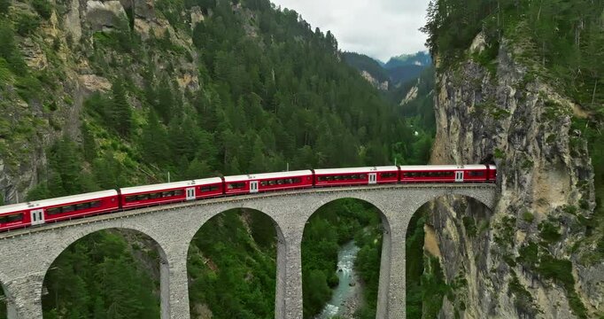 Aerial view Landwasser Viaduct world and Bernina express summer scenery. Railway scenic route in Switzerland