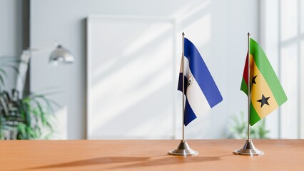 FLAGS OF EL SALVADOR AND SAO TOME ON TABLE
