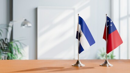 FLAGS OF EL SALVADOR AND SAMOA ON TABLE
