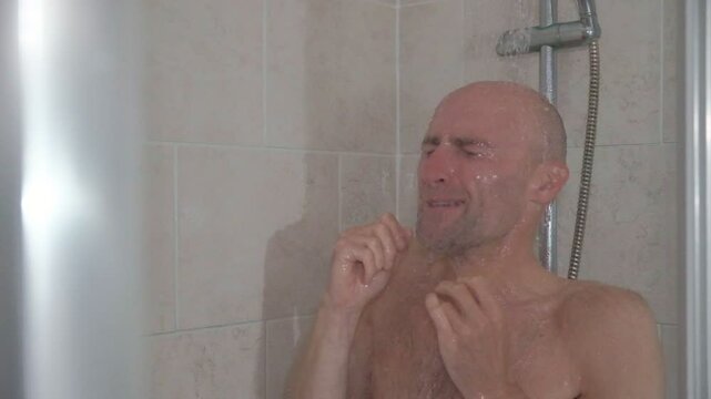50fps. Happy Bald middle aged man showering. Happy face expression. 
