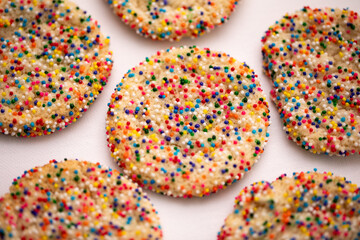 closeup of round sugar covered cookies with candy