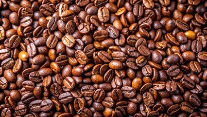 Obraz premium Close up of roasted coffee beans, forming a background texture.