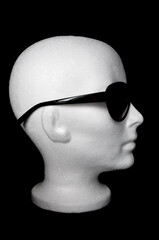 Replica of person's head wearing sunglasses 