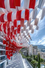 Naklejka premium Red and White Fabric Installation Over Modern Balcony, Monaco National Day