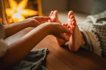 Gentle young girl hands providing a soothing foot massage for relaxation