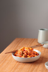 Kimchi, Kimchee in the Bowl, Red Spicy Kim Chi, Hot Fermented Napa Cabbage, Traditional Jimchi on a table