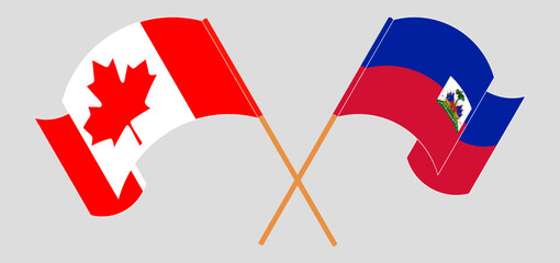 Crossed and waving flags of Canada and Republic of Haiti. Vector illustration