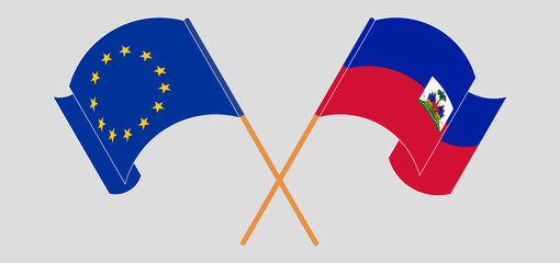 Crossed and waving flags of the European Union and Republic of Haiti. Vector illustration
