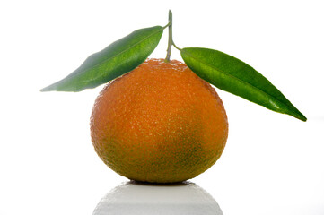 ripe mandarin with leaves close up on a white background