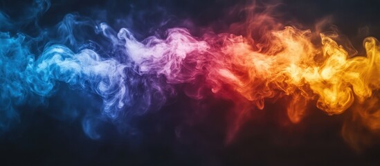 Obraz premium Abstract colorful smoke with blue and orange color swirling in black background.
