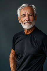 Obraz premium Healthy senior man in a fitness outfit, smiling confidently