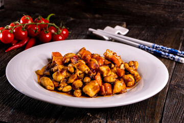 Di San Xian. Chinese Sautéed Potato Eggplants and Green Peppers  on wood table. Chinese food.