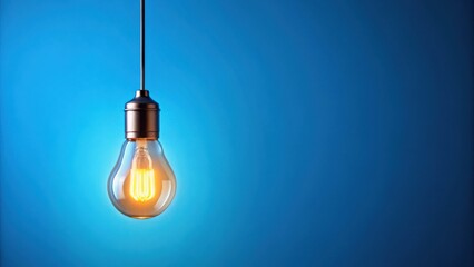A single illuminated light bulb hanging against a vibrant blue backdrop, symbolizing a spark of inspiration and the potential for new ideas.