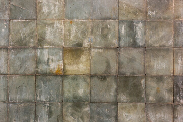 Texture of a squre concrete brick wall, dirty