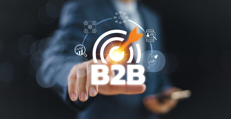 B2B business to business strategy concept. Businessman work with B2B digital icon on virtual interface, financial data analytics platform, partnership target technology services. E-commerce marketing
