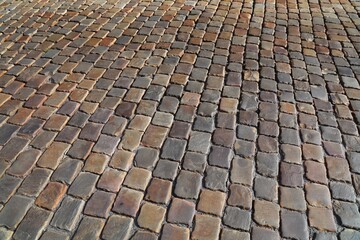 Porphyry stone pavement background in Prague