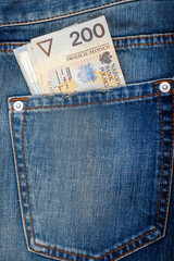 Polish zloty banknotes in jeans pocket