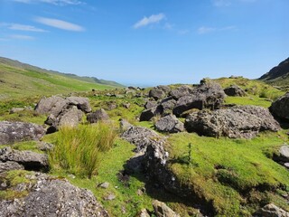 Scenic Summer Landscape Of Green Hills And Rocky Mountains In Ireland
