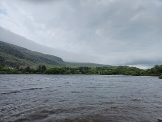 Serene Waterscape: Little Waves And Cloud Reflections