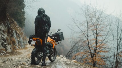 A worker dressed in protective gear sprays herbicide in a dense, foggy field, surrounded by mist.
