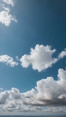 A clear blue sky with a few wispy white clouds, offering a crisp, fresh feel, with no obstacles in sight, perfect for a clean background
