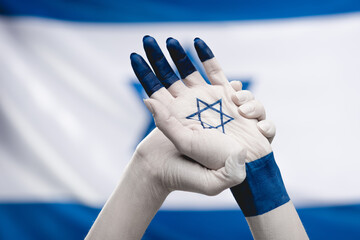 Two hands linked together with blue paint symbolize patriotism, showcasing unity and honor under...