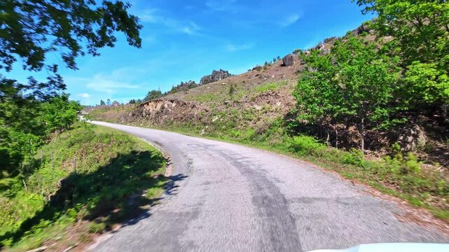 Driving with the car through the Peneda Geres National Park in Portugal, Europe. Area betweeen Cabril und Ruivaes