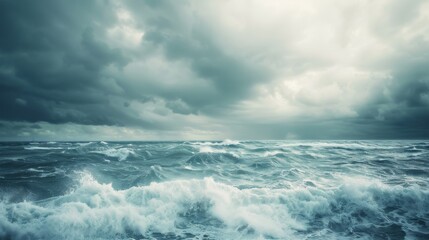 A stormy seascape with rolling waves under a turbulent sky captures the dramatic and untamed beauty of the ocean, evoking a sense of awe and power.