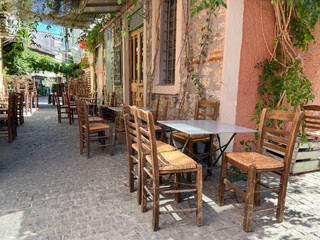 Fototapeta premium empty chair and tables of street cafe in the town