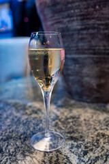 Tasting of brut and reserve grand cru champagne sparkling wine produced by traditional method in underground caves in Champagne, France, close up