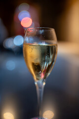 Tasting of brut and reserve grand cru champagne sparkling wine produced by traditional method in underground caves in Champagne, France, close up
