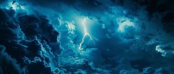 Fototapeta premium A singular lightning bolt slices through dense, dark clouds, casting an eerie, electrified glow across the midnight sky.