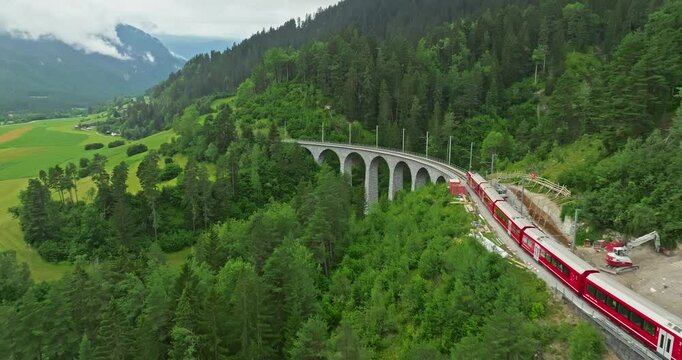 Aerial viw Landwasser Viaduct world and Bernina express summer scenery. Railway scenic route in Switzerland