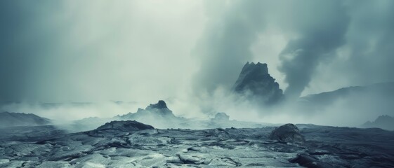 Fototapeta premium A vast volcanic landscape shrouded in mist with smoke rising from active areas, creating a powerful and dramatic view of nature’s ferocity.