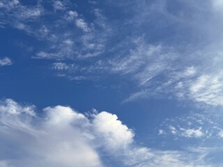 White clouds in the blue sky.