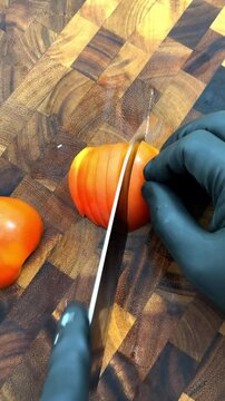 julienne cutting tomatoes on acacia wooden board.  
