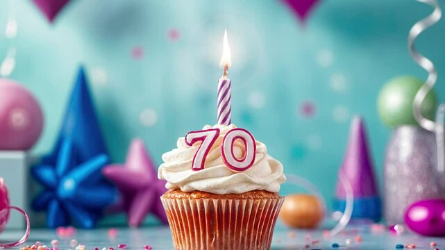 Birthday cupcake with burning lit candle with number 70. Number seventy for seventy years or seventieth anniversary.
