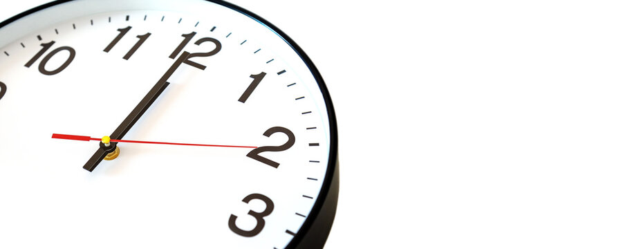 First two seconds of the New Year. Close-up of a round clock with a white dial and hands showing the first seconds after 12:00 or 0:00, to 24:00. Time management.