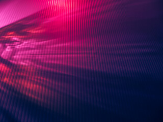 Obraz premium Light reflects dark pink and purple tones in the dark for a mysterious New Year background. 