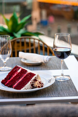 Close-up of a decadent red velvet cake layered with rich cream cheese frosting, beautifully decorated with fresh berries. This vibrant dessert is perfect for celebrations, showcasing a gourmet baking 