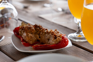 Red peppe stuffed with meat and vegetables graten cheese on top Azores Portugal