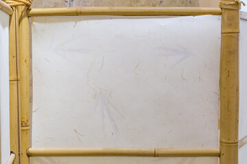 One panel of folding bamboo screen indoor, background