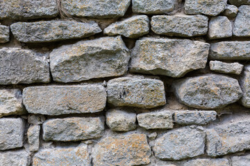 Fragment of stone wall of ancient defensive structure