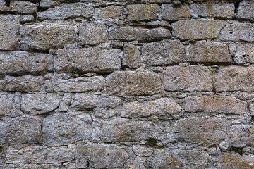 Fragment of stone wall of ancient defensive structure