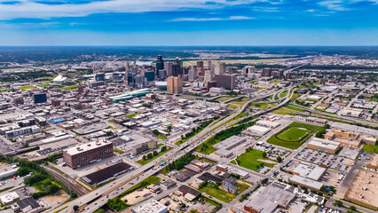 Obraz premium Flying above the urban landscape with low-rise and high-rise buildings. Sunny view of Chicago, Illinois, USA from top.