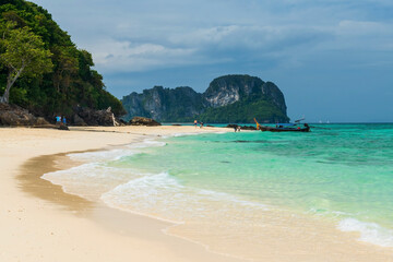 Travelers on seashore of Koh Phai or Bamboo island, Krabi